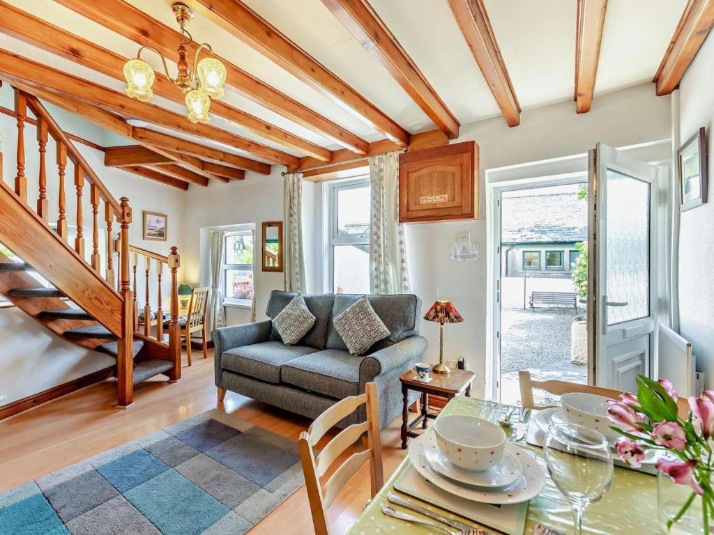 a living room with a table and a couch at 2 Bed in Keswick oc-sz145 in Braithwaite