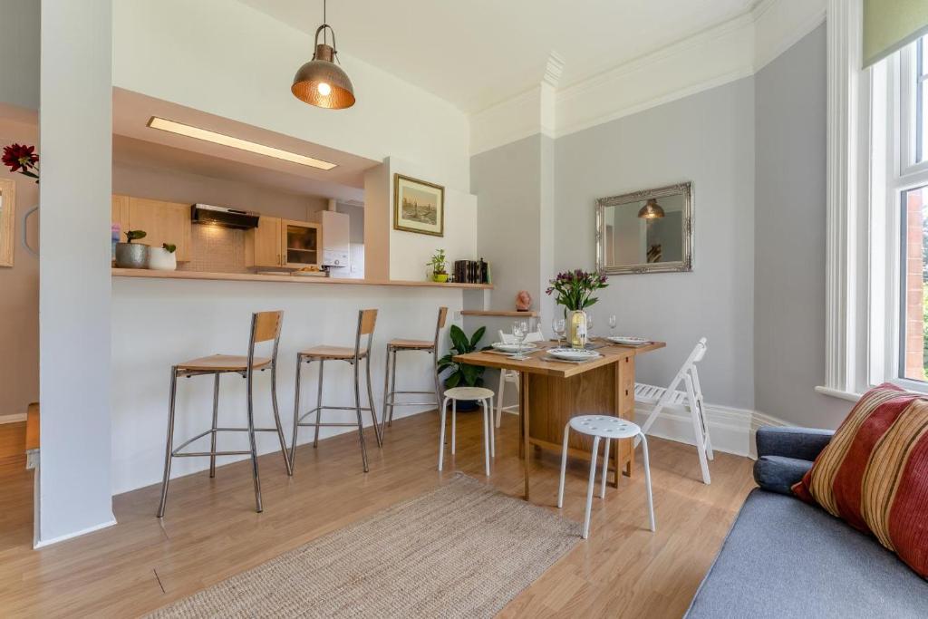 a kitchen and living room with a table and chairs at 2 Bed in Bexhill-on-Sea oc-t29534 in Bexhill