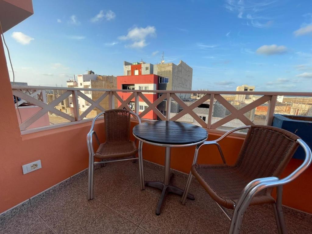 a table and chairs on a balcony with a view at Larriba Santa Maria by RPG Group in Santa Maria