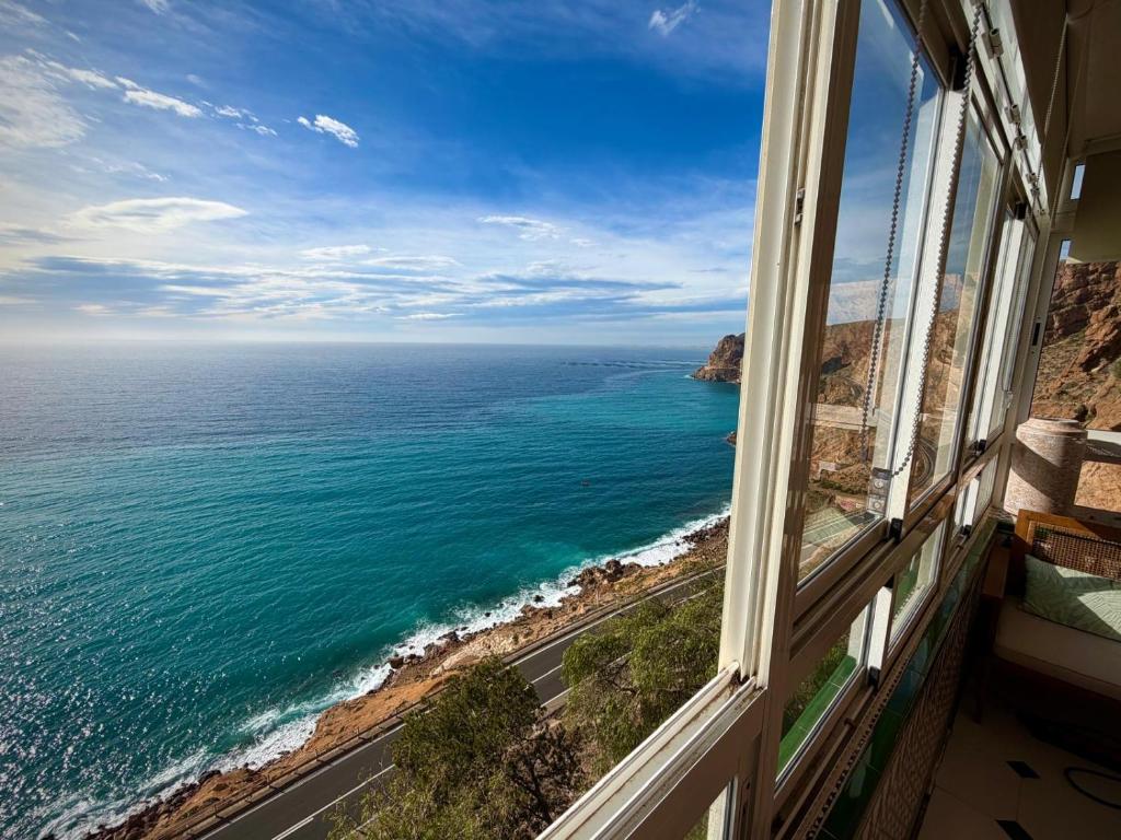 a view of the ocean from a window at El Barco in Almería