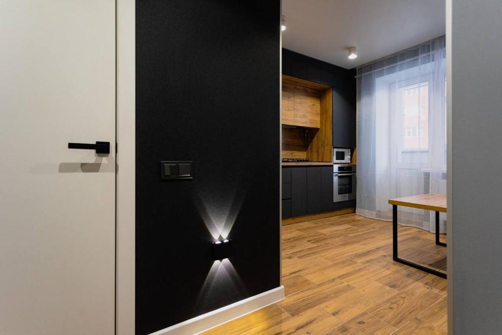 an open door to a kitchen with a table at Center 2 poverh Ecoflow VIP TopApart in Sumy