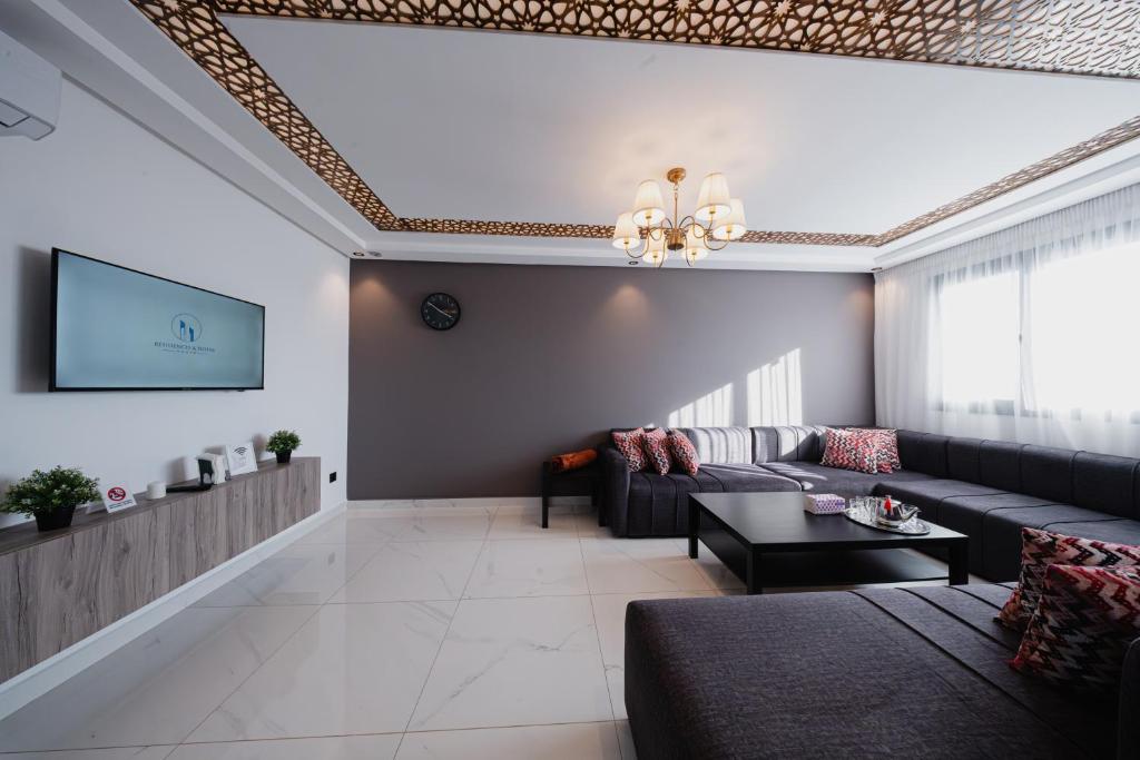 a living room with a couch and a table at Résidences Nador in Nador