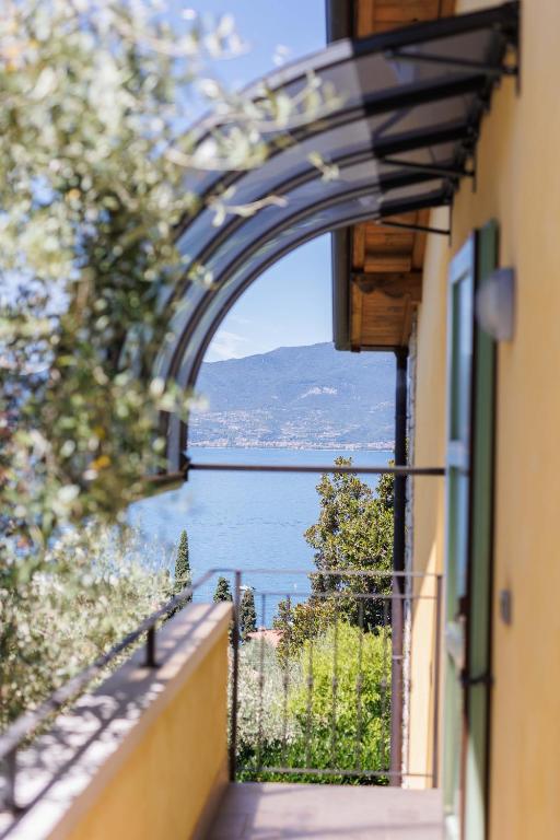 a view of the water from a balcony of a building at Casa Giordana in Torri del Benaco