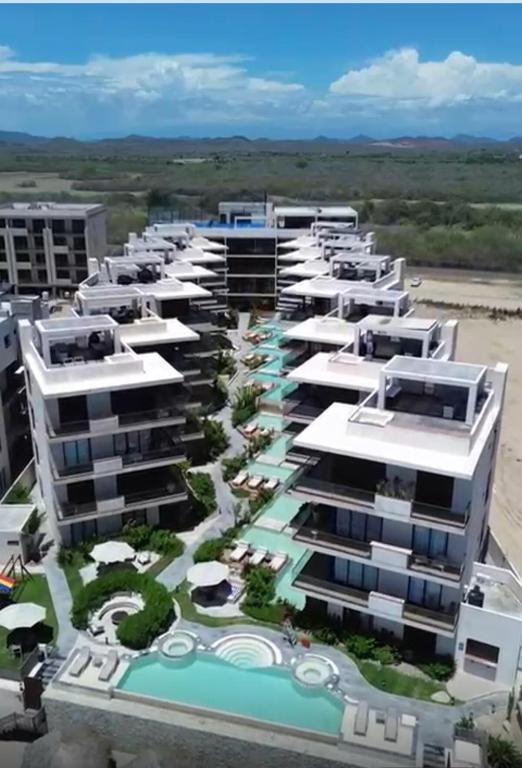 an aerial view of a resort with a pool at Beach Loft Style and Beach Heated Pool in Mazatlán