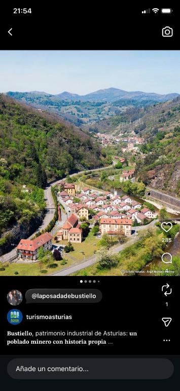 an iphone screen with a picture of a town at POSADA de BUSTIELLO,poblado minero de interés cultural in Mieres