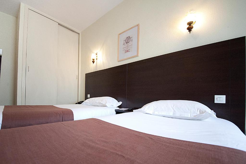 Postel nebo postele na pokoji v ubytování Le Chatel