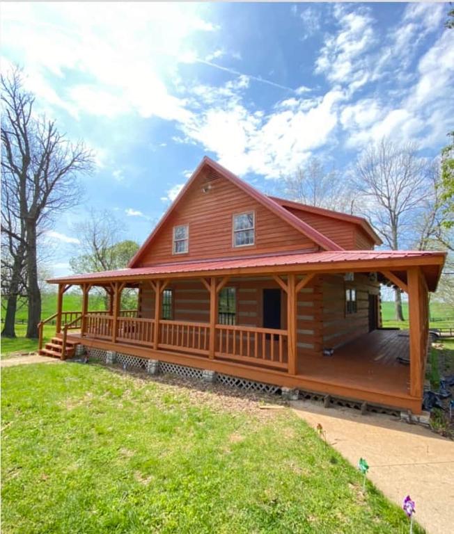 a large wooden cabin with a large deck at Governor's Private Cabin on Bourbon Trail w HotTub in Harrodsburg