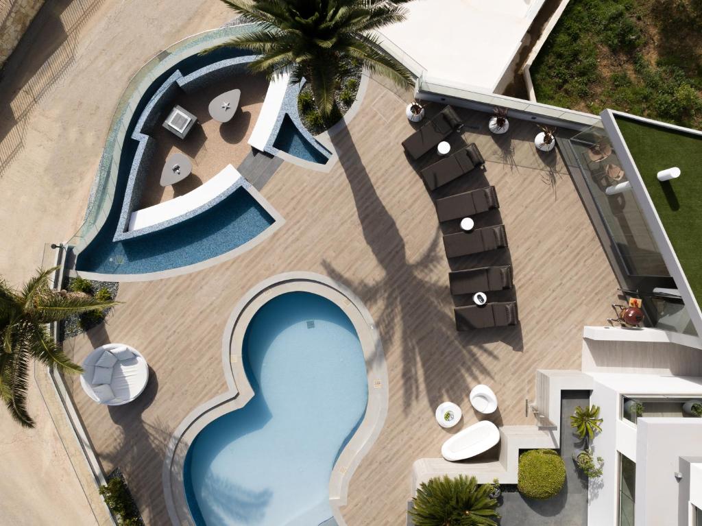 an overhead view of a swimming pool with a resort at Villa Kalliston - 4000m2 of Elevated Living in Rethymno