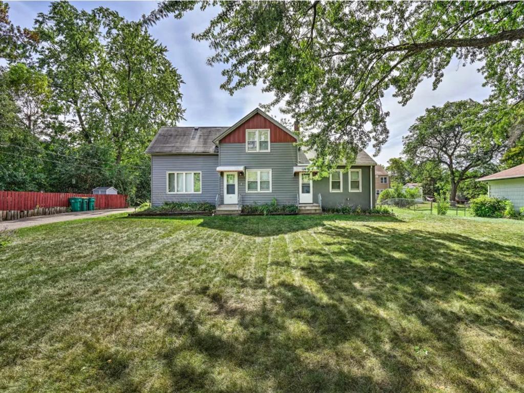 a house with a large yard in front of it at Stay St Paul Haven in West Saint Paul