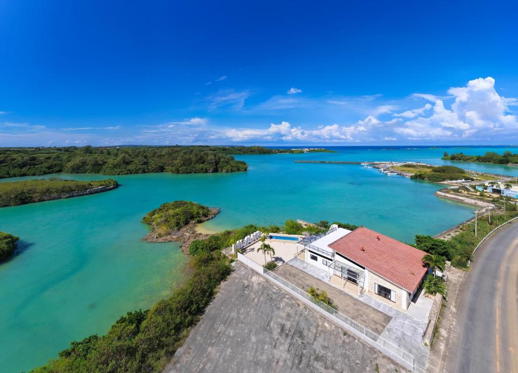 an aerial view of a house on a island in the river at クリスタルヴィラ大浦 in Miyako-jima