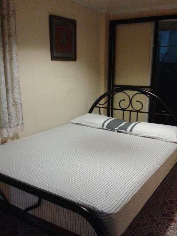Postel nebo postele na pokoji v ubytování Vhauschild Transient Rooms