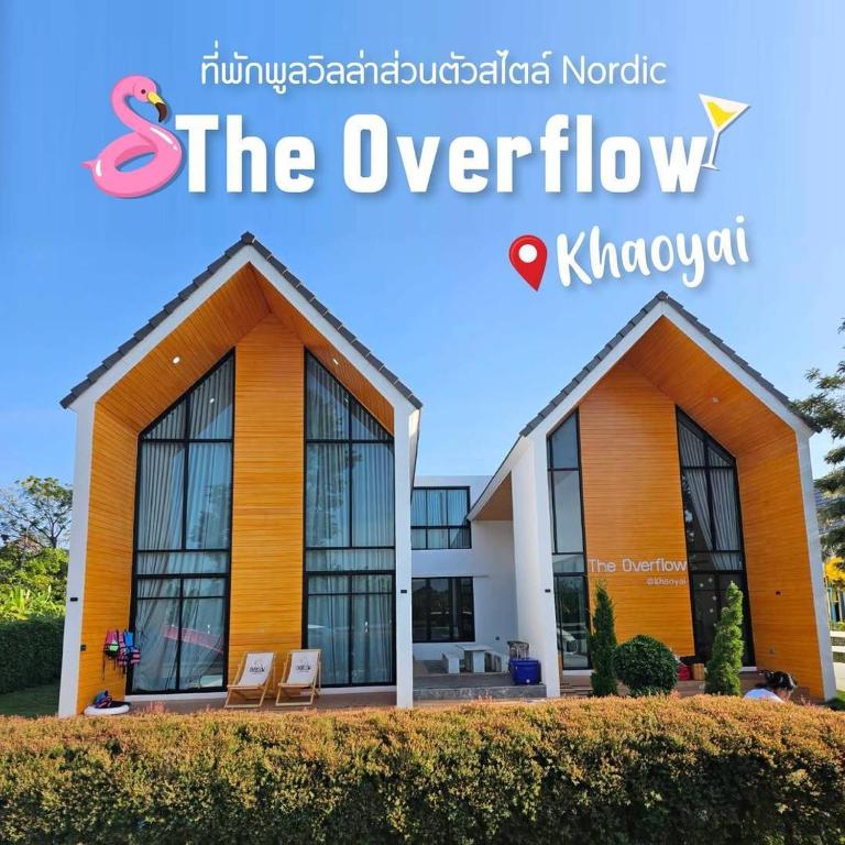 a sign for the overflow kalamazoo building at บ้านพูลวิลล่าเขาใหญ่ The Overflow in Wangkata