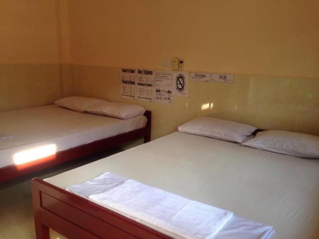 Postel nebo postele na pokoji v ubytování Ta Eng Guesthouse