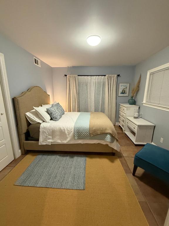 a bedroom with a bed and a window at Eastside Costa Mesa Residence in Costa Mesa