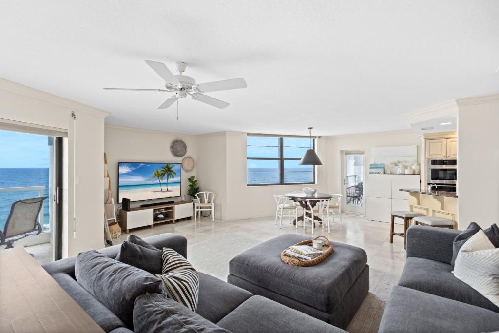 a living room with a couch and a table at Privateer #601 in Longboat Key