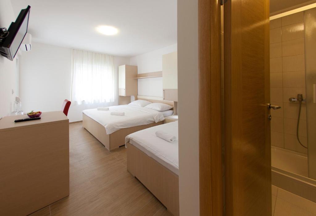 Posteľ alebo postele v izbe v ubytovaní Villa Klara Guest House