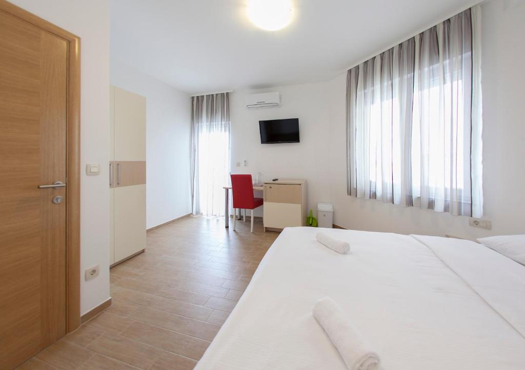 Postel nebo postele na pokoji v ubytování Guesthouse Villa Klara