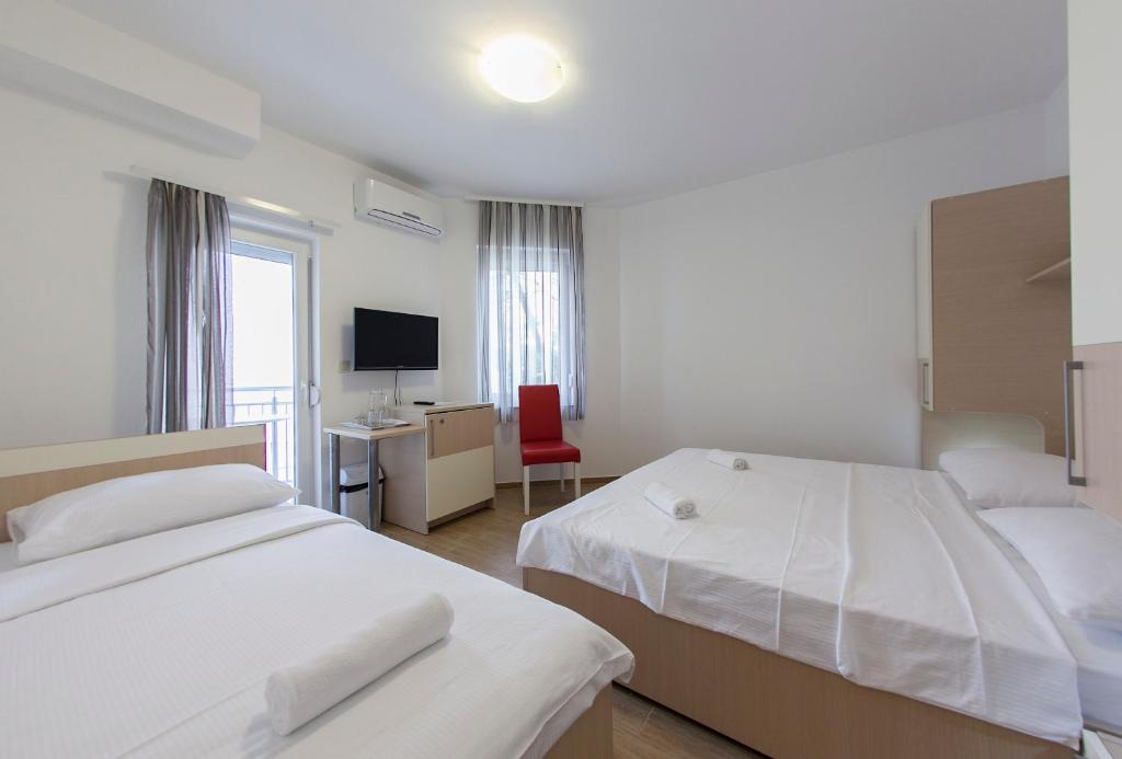 Postel nebo postele na pokoji v ubytování Guesthouse Villa Klara