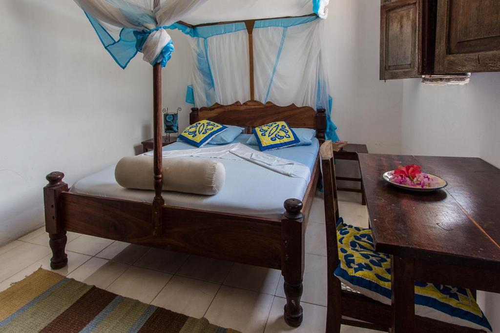 Postel nebo postele na pokoji v ubytování Kiponda B&B