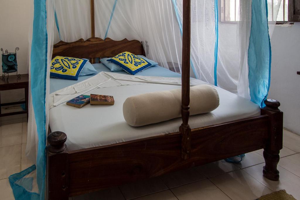 Postel nebo postele na pokoji v ubytování Kiponda B&B