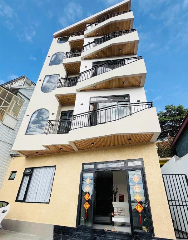 a tall building with balconies on top of it at The SunHill in Da Lat
