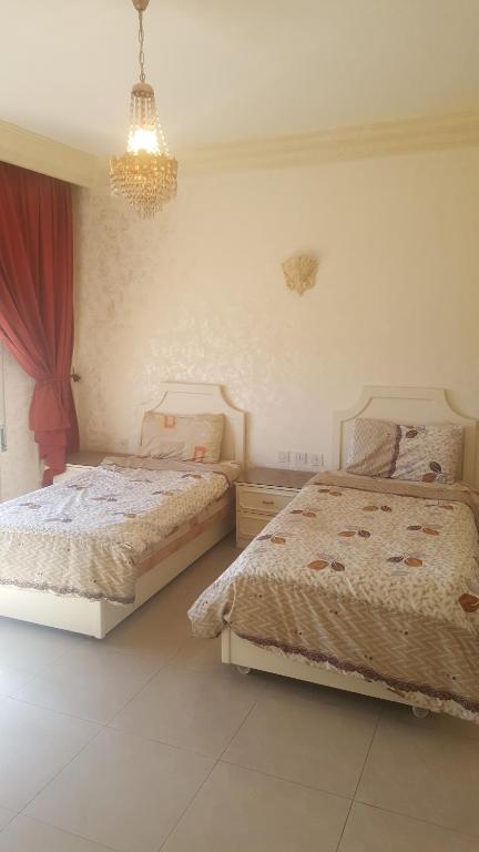 Postel nebo postele na pokoji v ubytování Al Khaleej Hotel Apartments