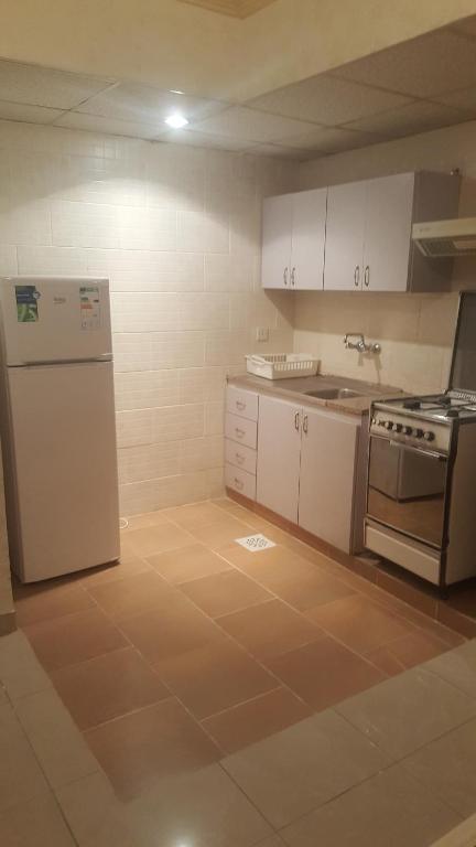 Kuchyň nebo kuchyňský kout v ubytování Al Khaleej Hotel Apartments