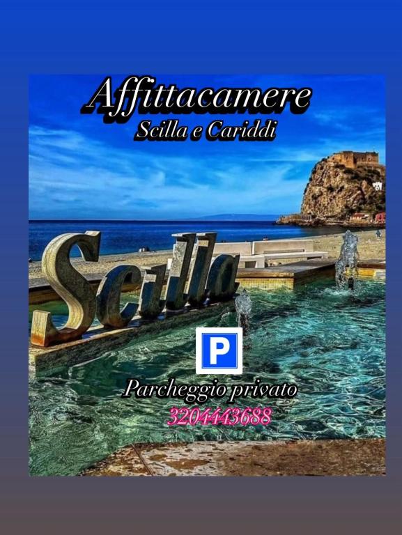 a sign for a resort on the beach with the ocean at Scilla e Cariddi in Scilla