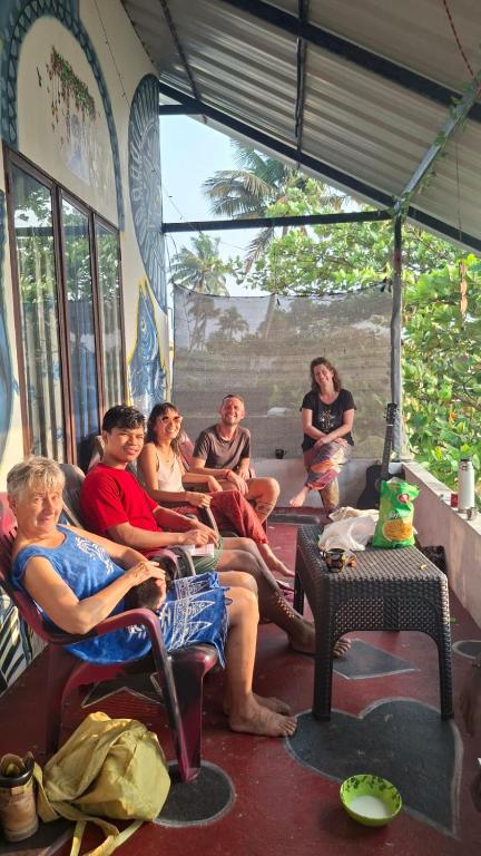 a group of people sitting on a bus at Paradise beach homestay in Alleppey