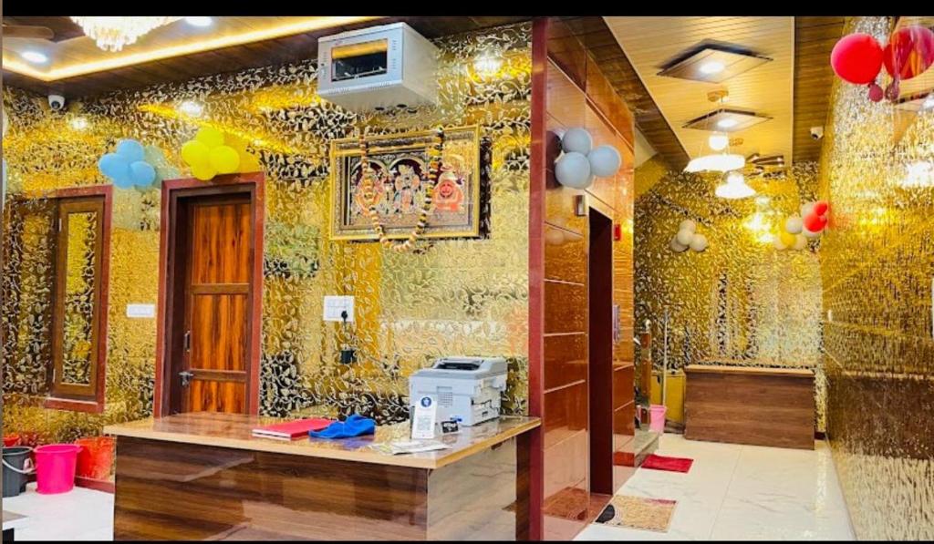 a room with a decorated wall with balloons on it at Hotel Shree Govind Dev and Restaurant in Khātu
