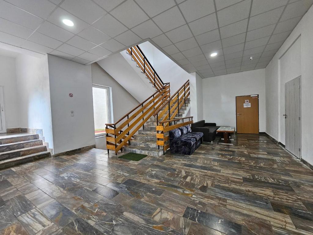 an empty room with a staircase in a building at JOPEL ubytovanie v súkromí in Slovenské ďrmoty