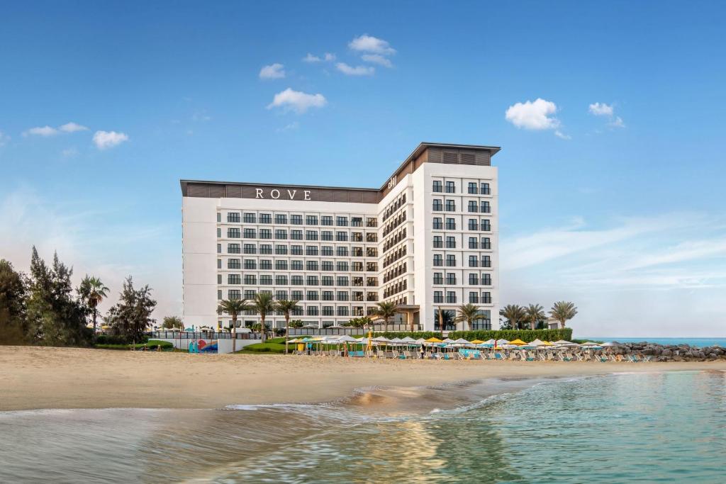 a hotel on the beach next to the beach at Rove La Mer Beach, Jumeirah in Dubai