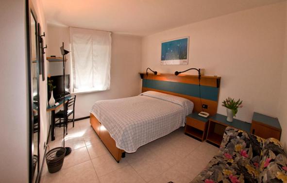 Postel nebo postele na pokoji v ubytování Albergo Alla Torre