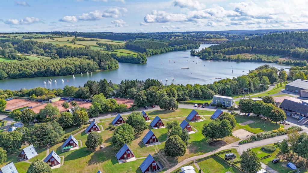 an aerial view of a river with a group of tents at Sport- und Ferienpark Worriken in Butgenbach
