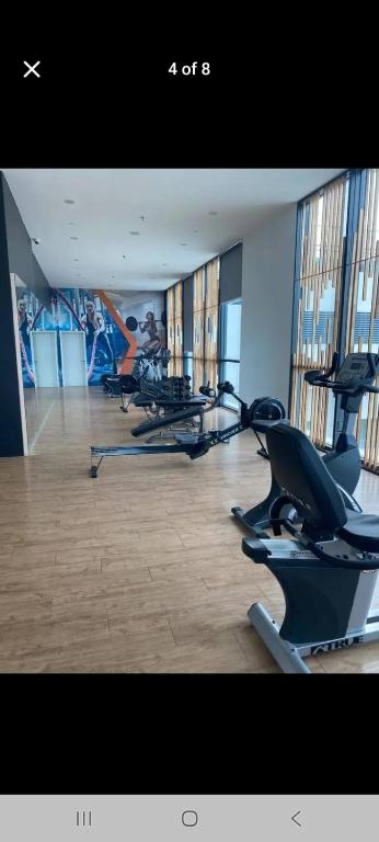 a gym with several treadmills and elliptical machines at D Elite in Kota Bharu