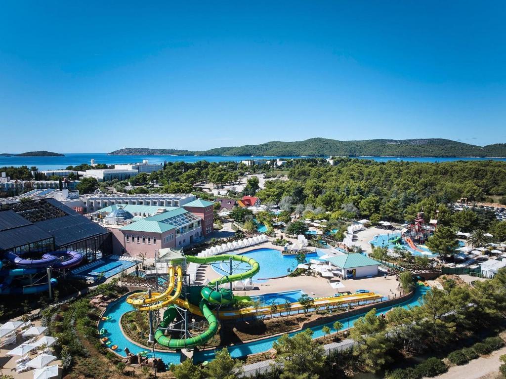an aerial view of a water park with a roller coaster at Resort Šibenik in Šibenik