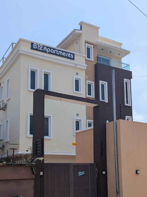 a building with a sign on the side of it at B-12 Apartments in Lagos