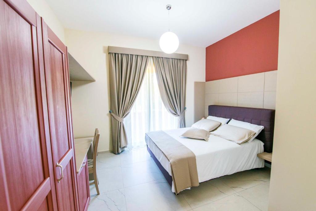 Postel nebo postele na pokoji v ubytování Agriturismo Borgo Imperiale