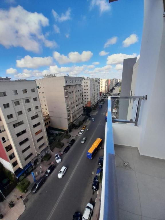 a view of a city street with cars and buildings at Al Anouar 39B in Kenitra