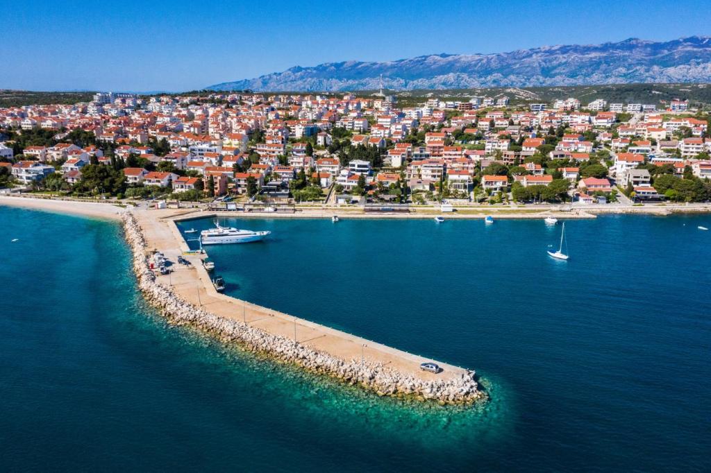 an aerial view of a beach with boats in the water at Villa Laverna Annex in Novalja