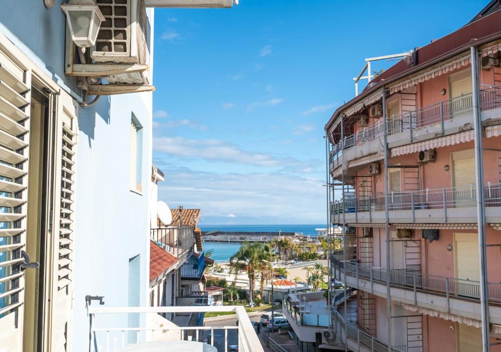 a view of the ocean from a balcony at Hotel Villa Nefele in Giardini Naxos