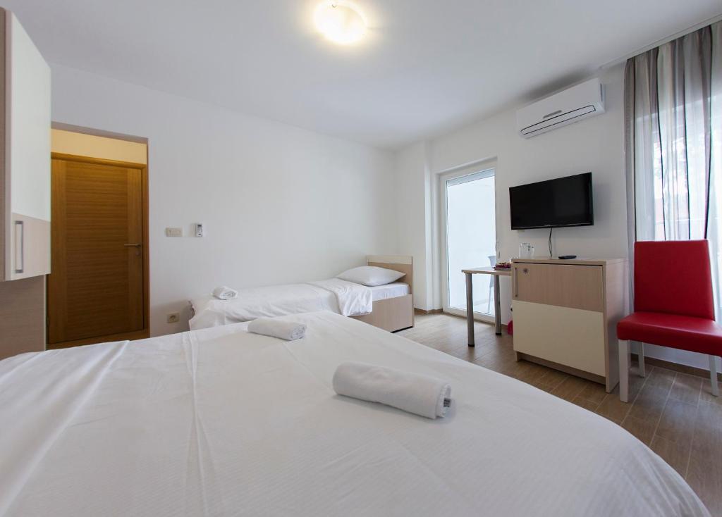 Posteľ alebo postele v izbe v ubytovaní Villa Klara Guest House