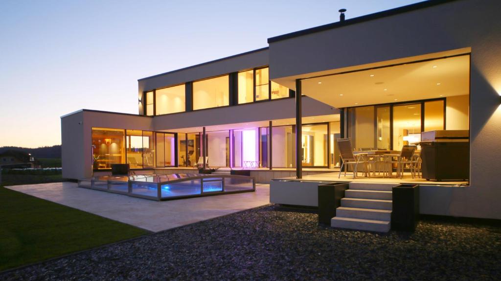 a large house with a view of the backyard at Eifelvilla Weber in Arenrath