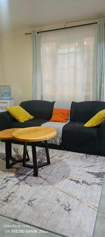 a living room with a couch and a coffee table at Savannah milestone in Gilgil