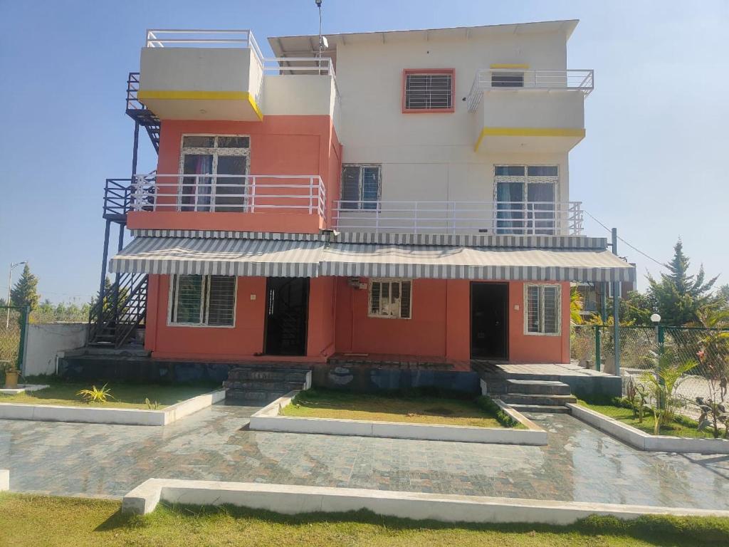 a red and white building with a balcony at Nandi Holiday Homestay in Nandi
