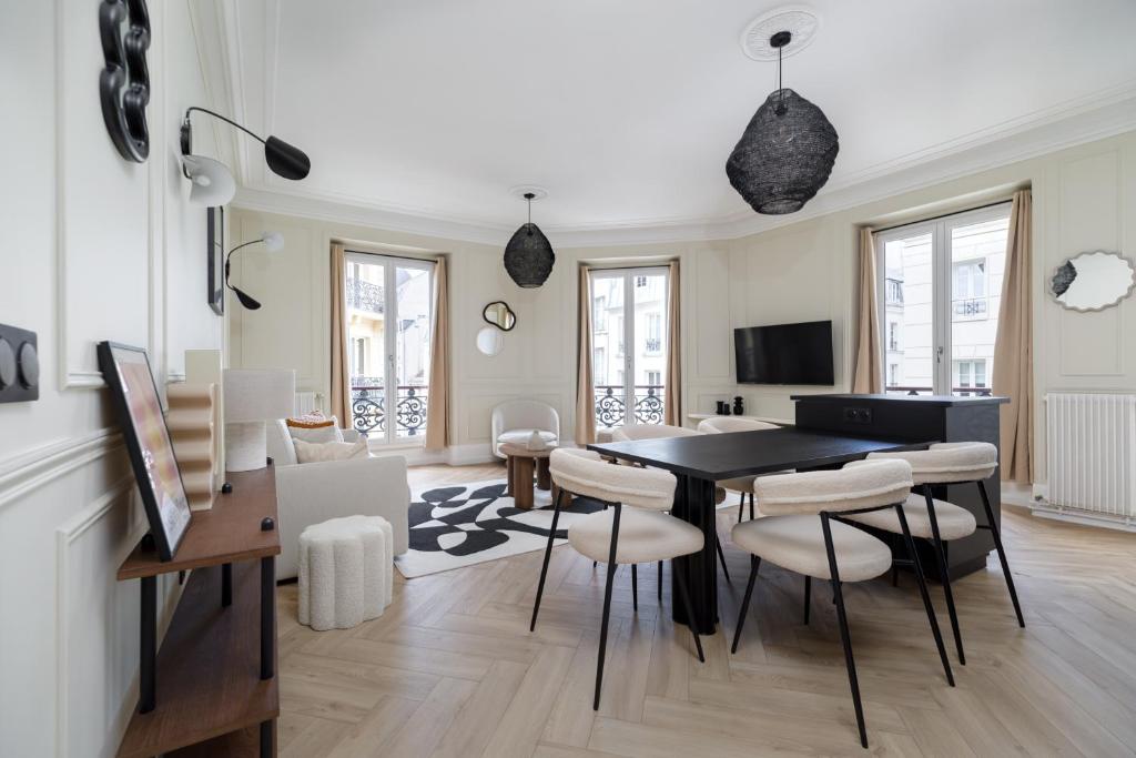 TV i/ili multimedijalni sistem u objektu Spacious Apartment 2BDR
