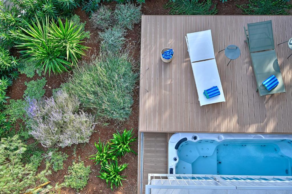 an overhead view of a deck with a pool and chairs at Jadrija Luxury Vacations Apt1 in Šibenik