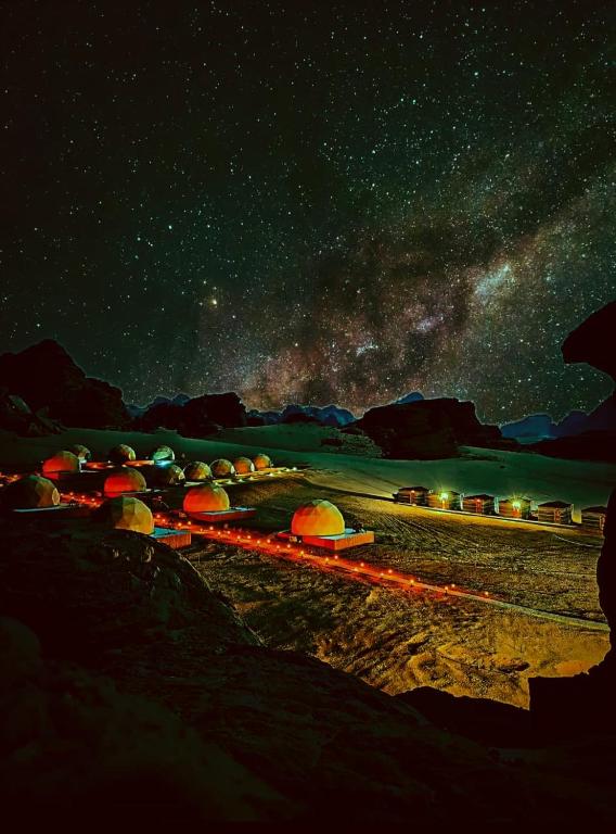 a starry night with a train on the tracks at Ayla Rum Luxury Camp in Wadi Rum