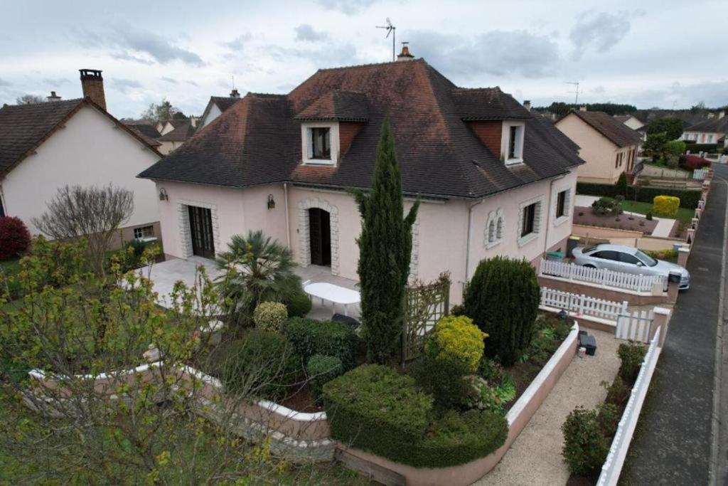 a large white house with a lot of plants at La Changéenne - Maison de charme - 12 pers in Changé