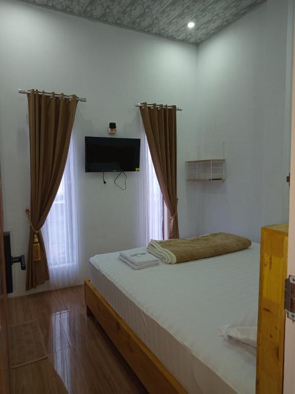 M2 Homestay Berastagi - Camera Deluxe (2 Adulti + 1 Bambino)